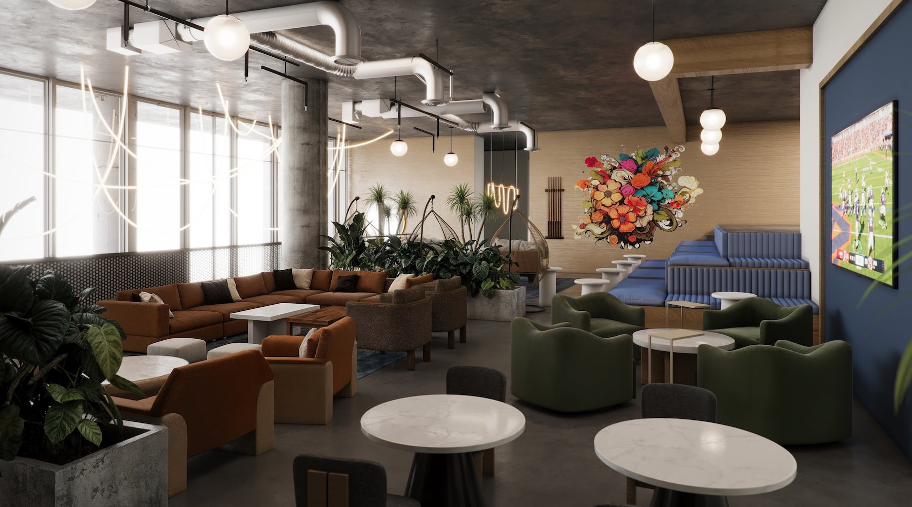 a clubroom with a couch, tables and chairs