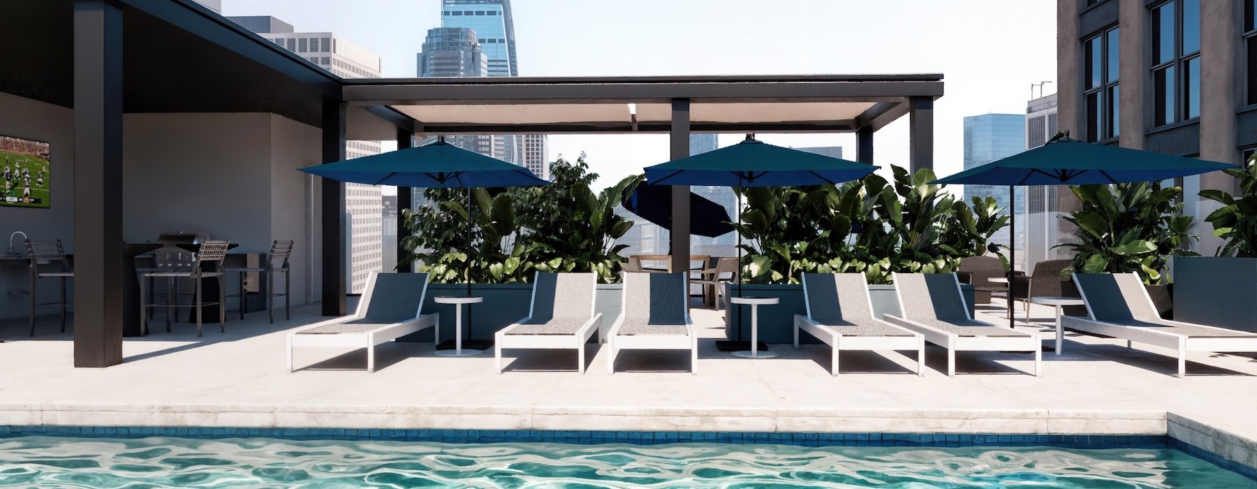 a swimming pool with lounge chairs