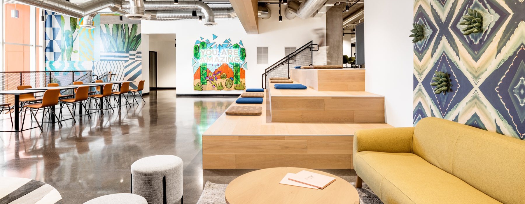 a clubroom with a couch and tables