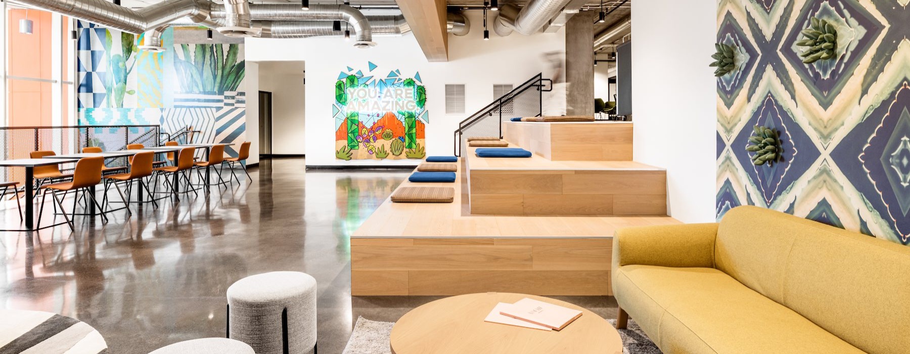 a clubroom with a couch and tables