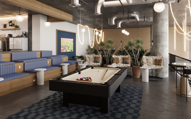 a clubroom with a pool table and chairs