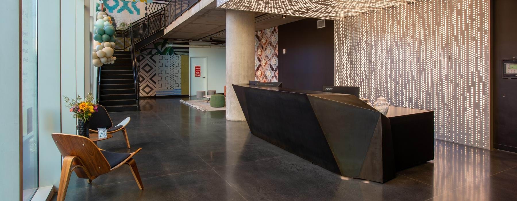 a leasing office front desk with chairs and a table